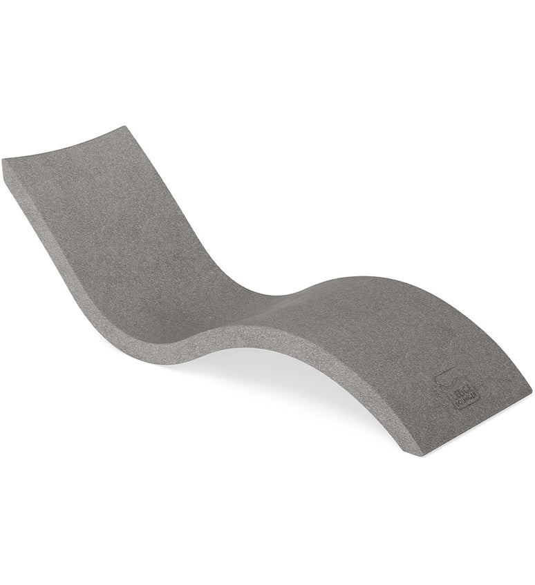 Curved sandstone chaise lounge with a smooth, wave-like shape on a plain white background.