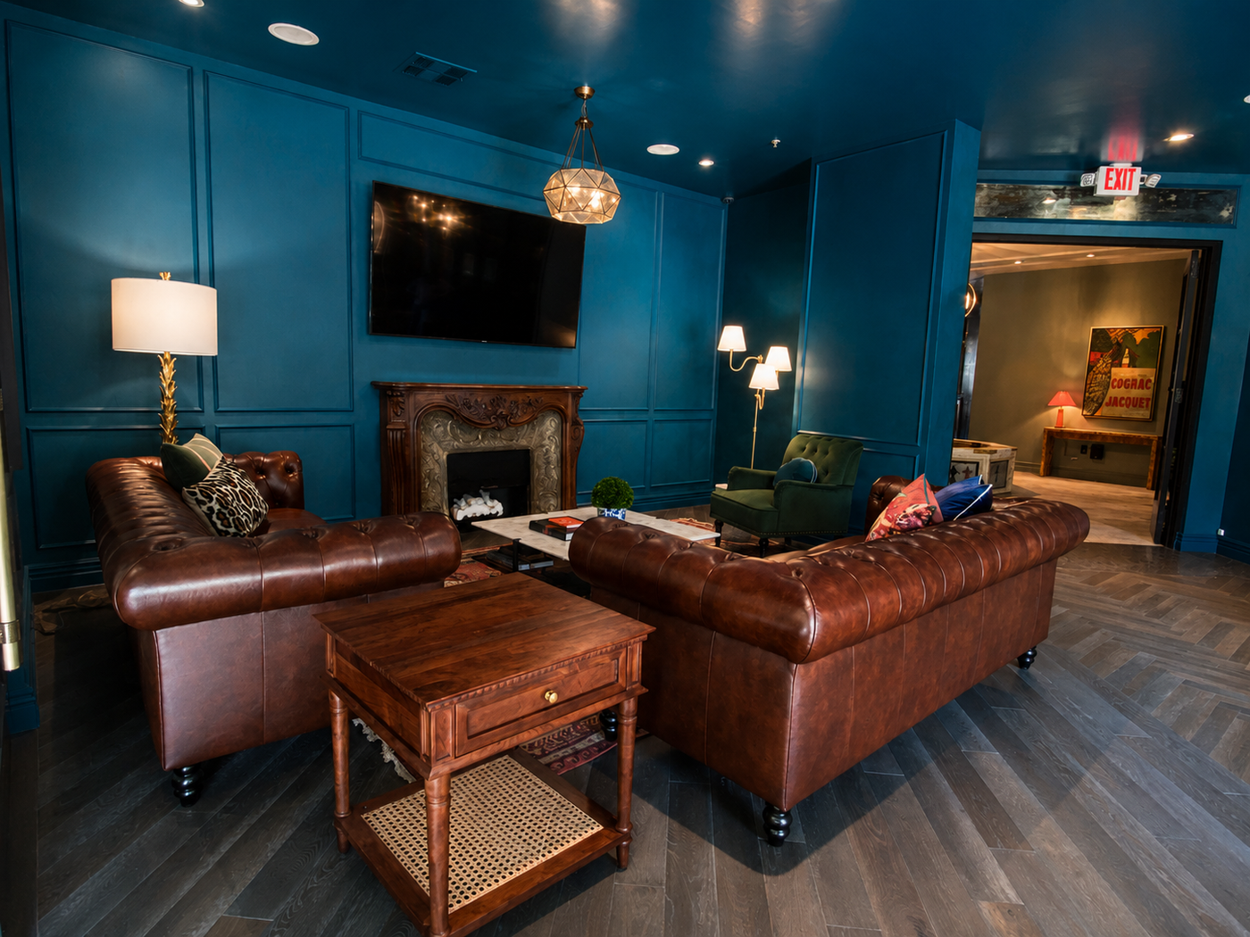 Luxury living room with leather sofa, wooden coffee table, and decorative elements.