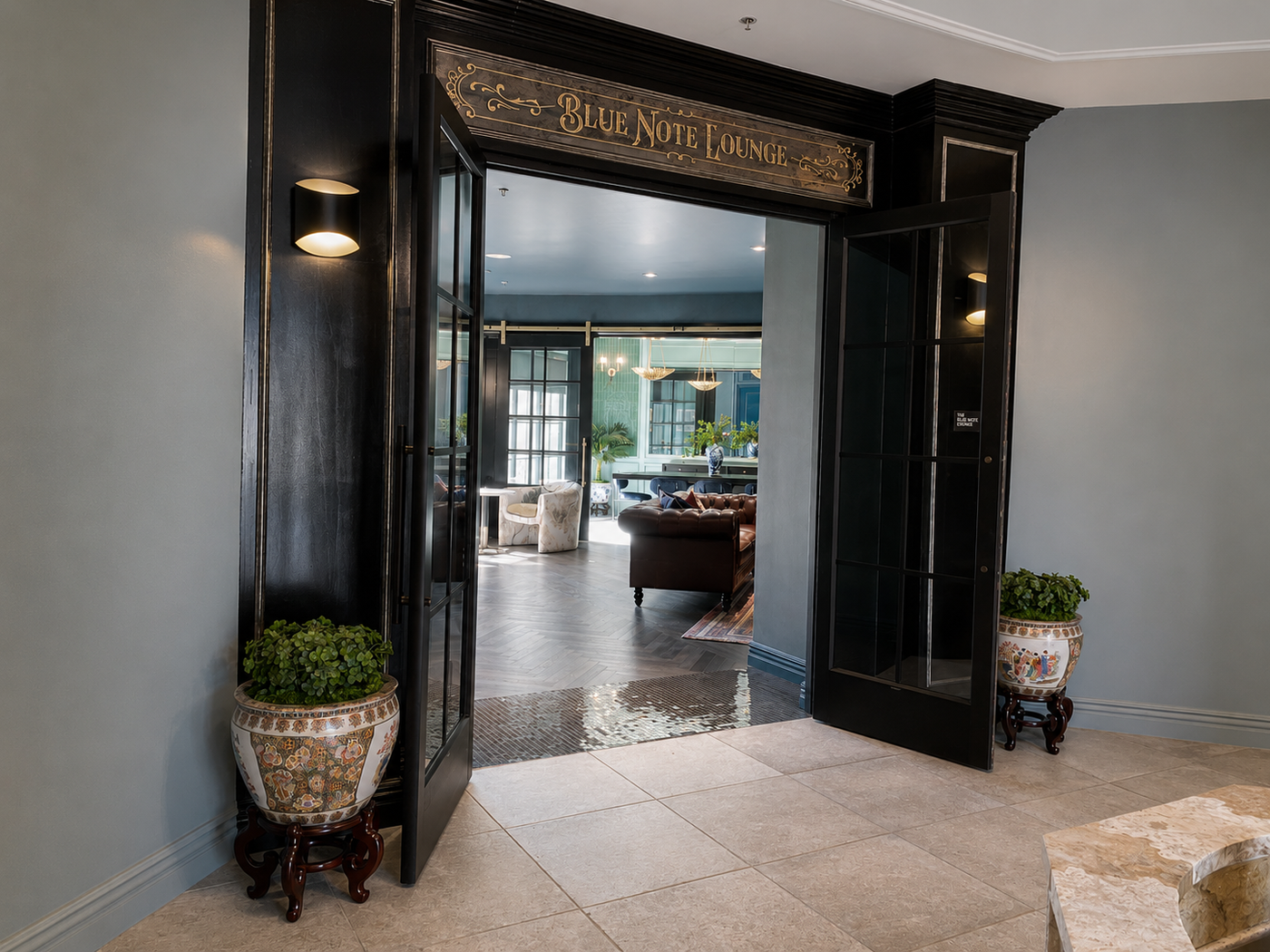 Decorative entrance to a lounge named 'Blue Note Lounge' with potted plants on either side.