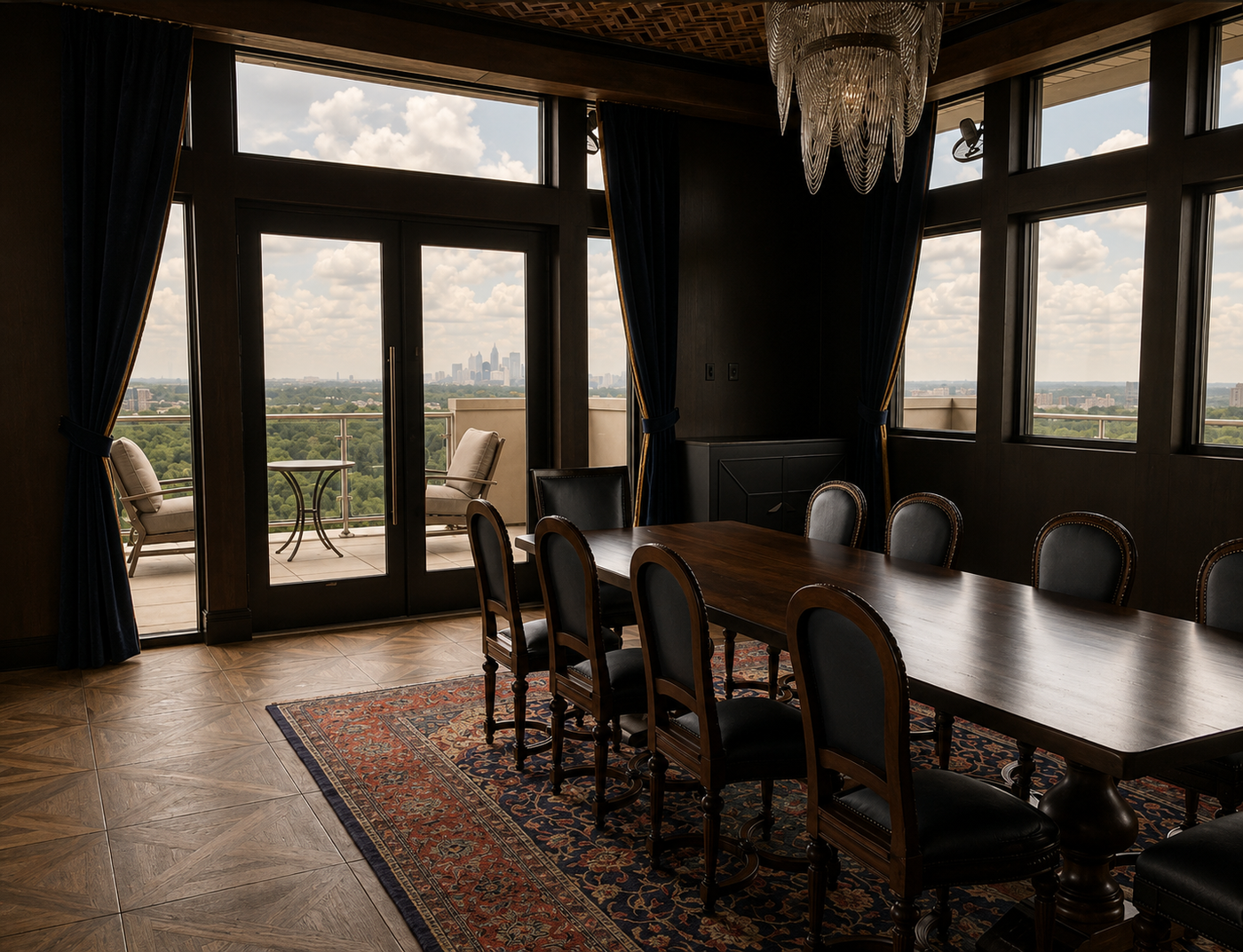 Dining room with large windows, table, and chairs overlooking a cityscape.