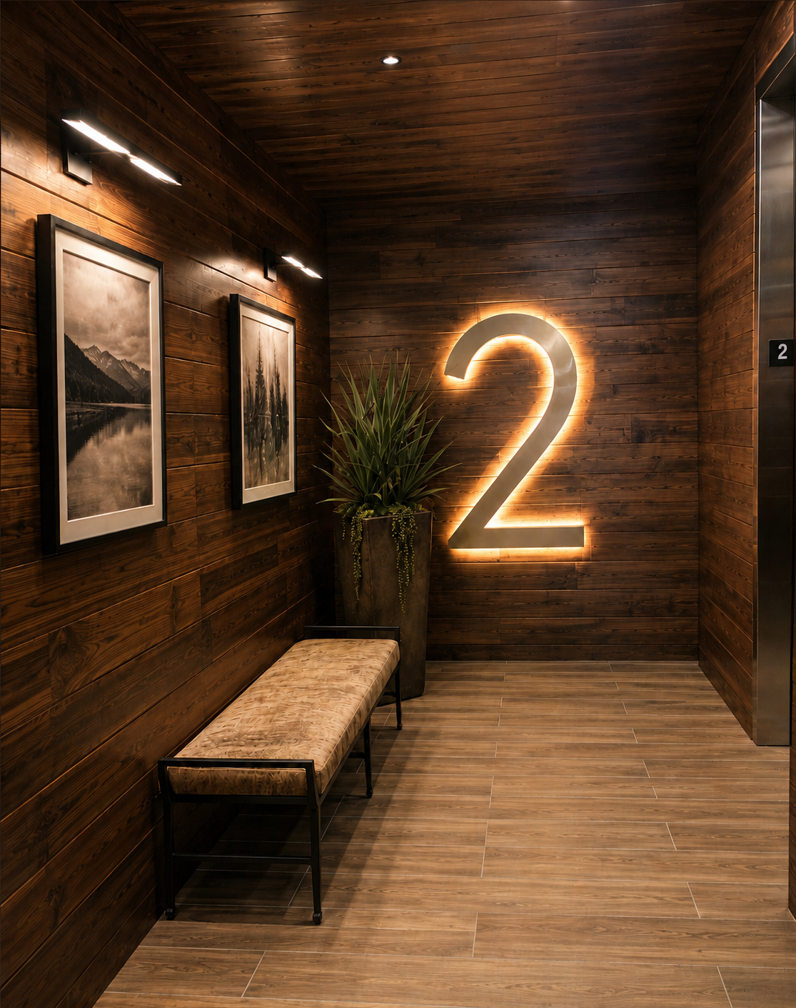 Wooden elevator lobby with a bench, potted plant, and illuminated number '2' on the wall.