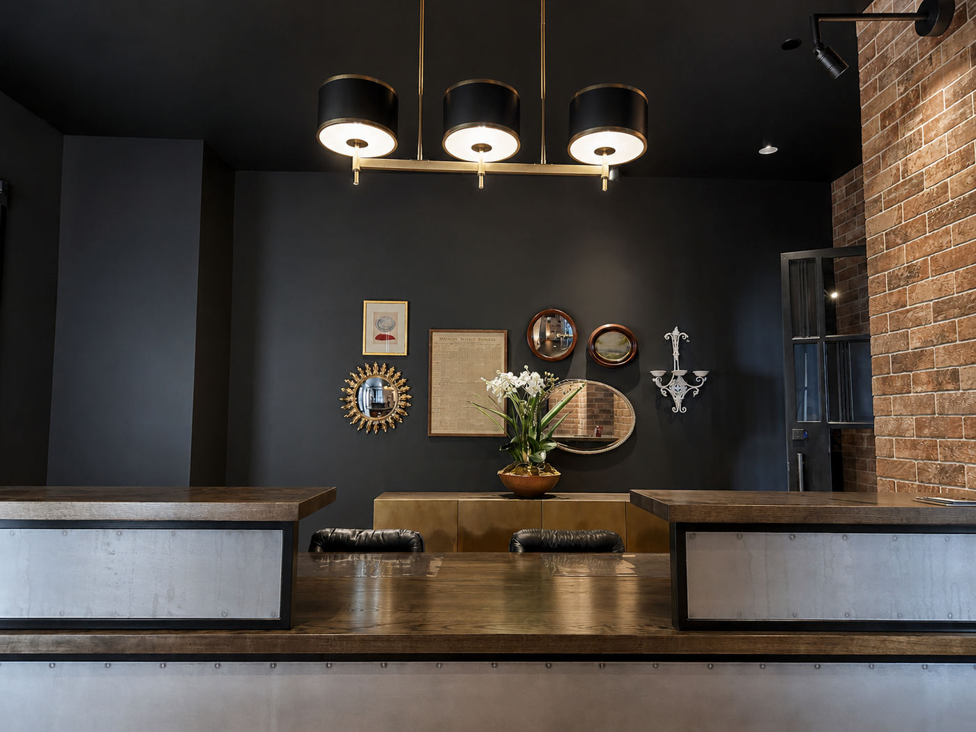 Modern interior design with dark walls, wooden furniture, and decorative elements.