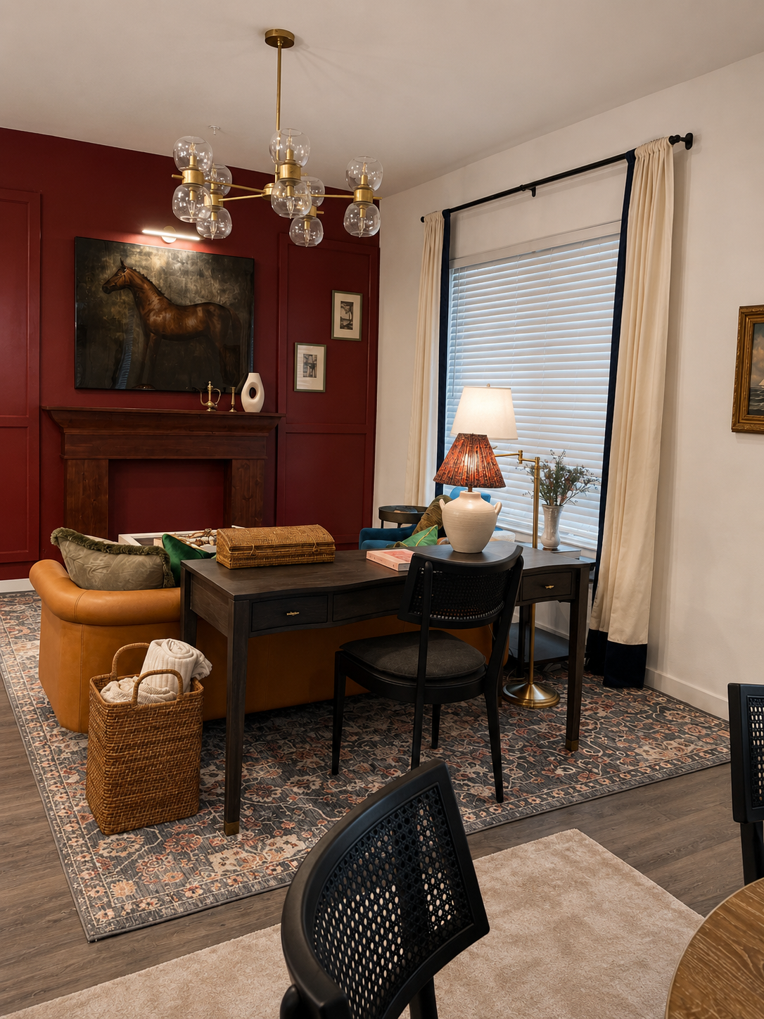 Living room with a fireplace, desk, and various decor items.
