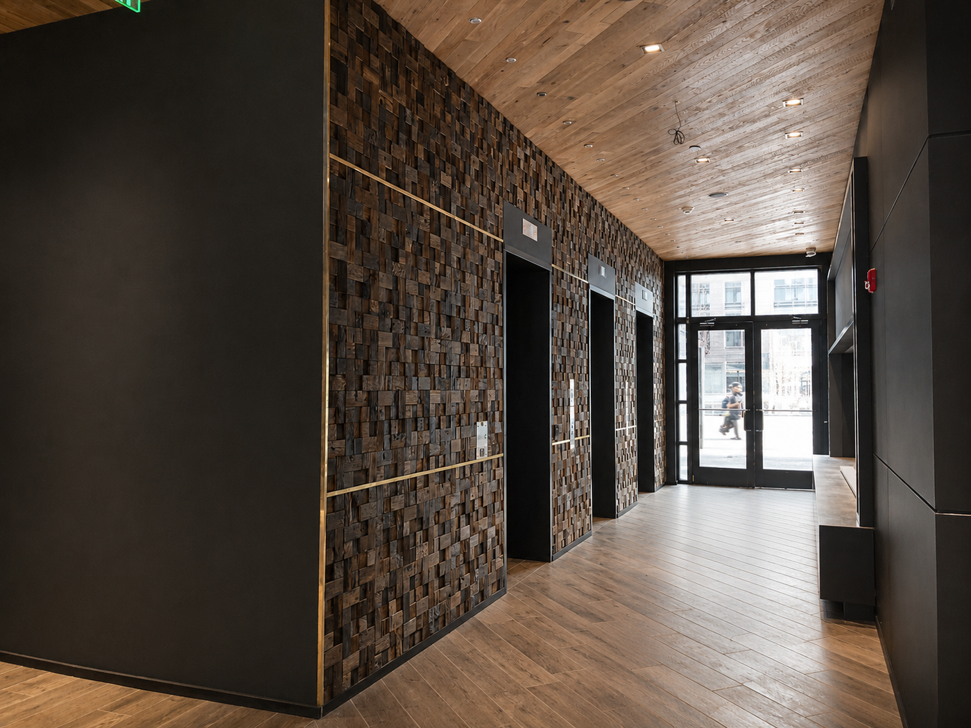 Modern interior hallway with wooden flooring and textured walls.
