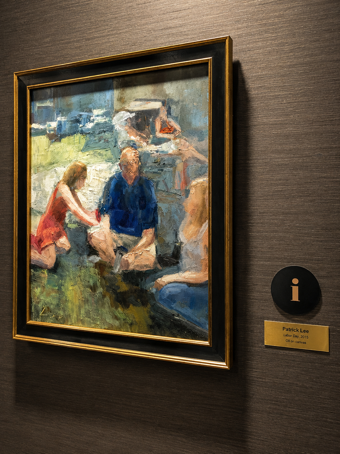 Framed painting of a group of people on a wall with a label indicating the artist's name.