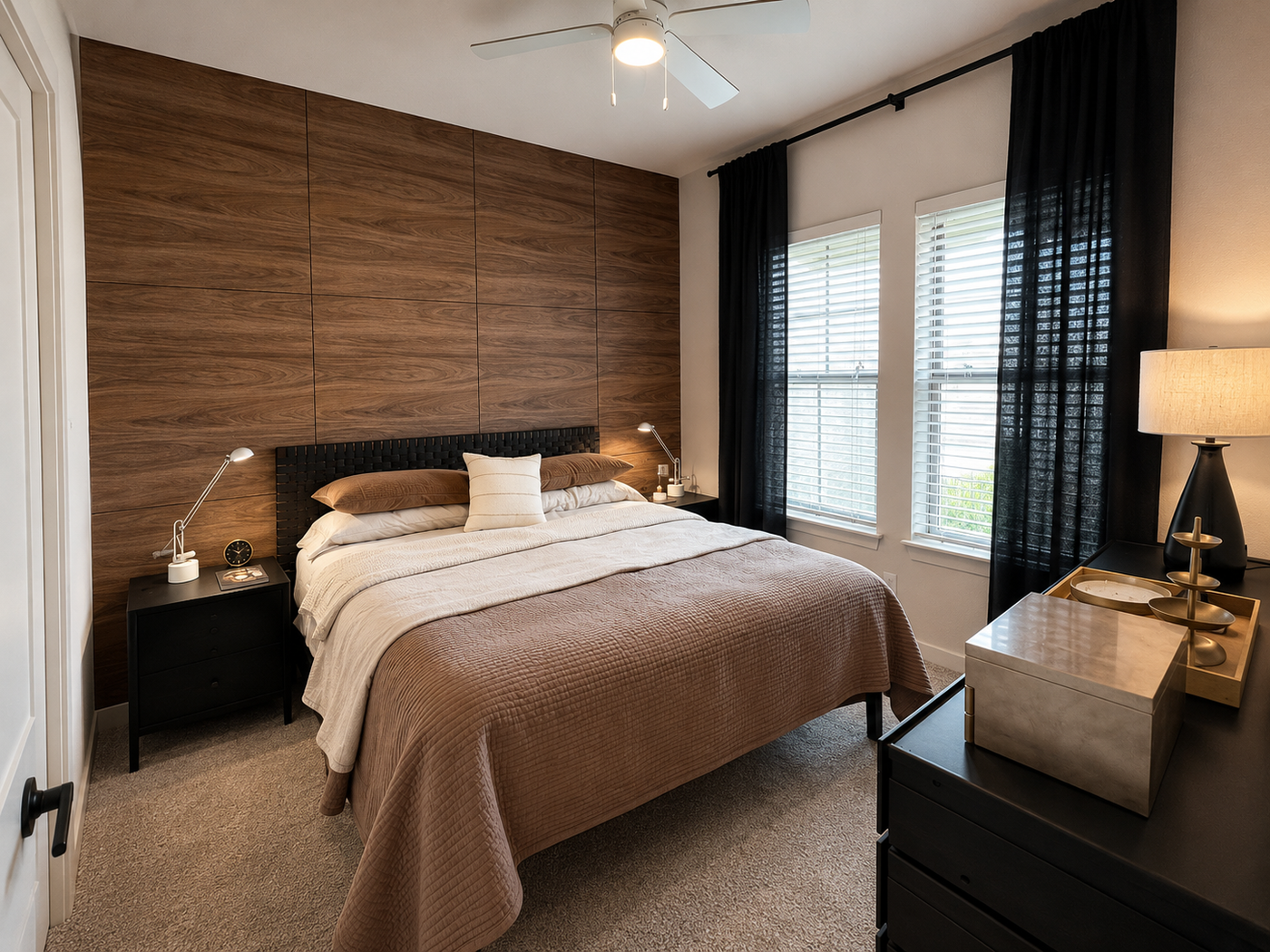 Modern bedroom with wooden headboard, bed, and nightstands.