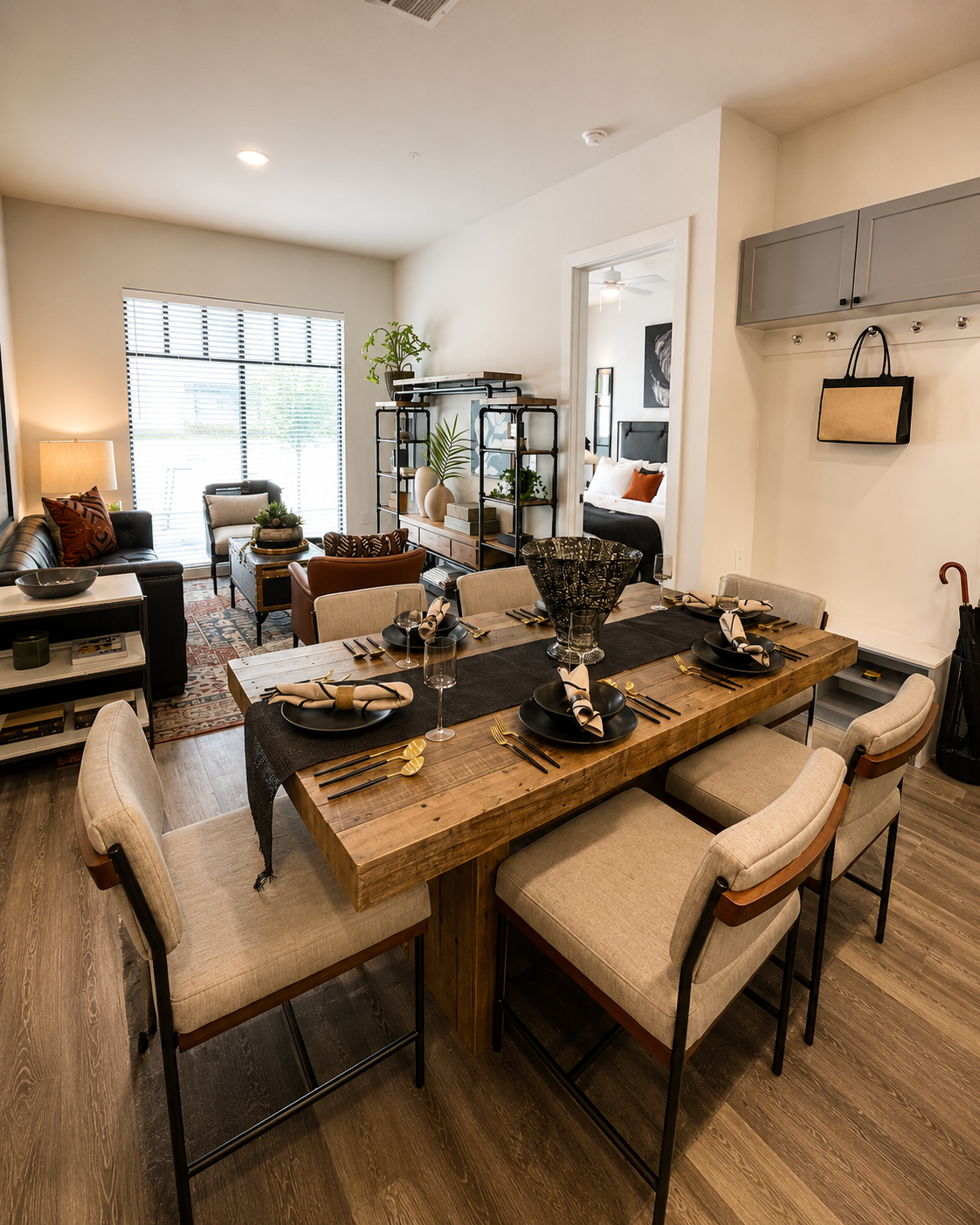Dining area with a wooden table and chairs in a modern living room.