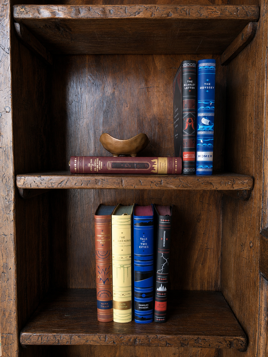 Wooden bookshelf with books and a decorative object